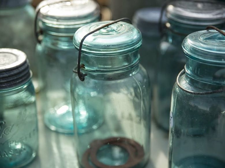Several glass jars with lids clamped on