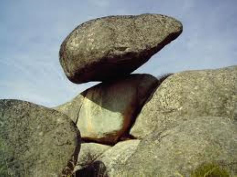 Large rock precariously balanced upon another