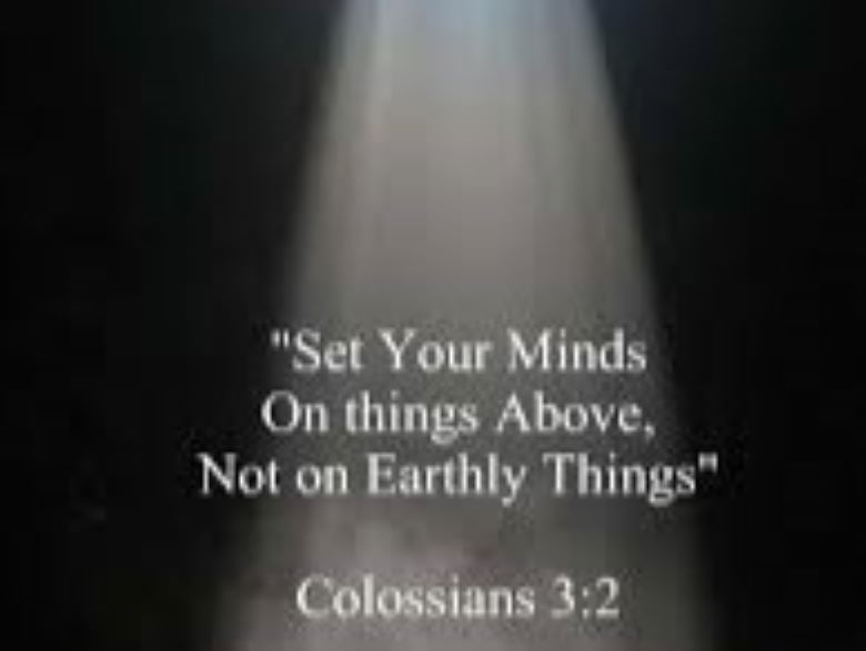 Colossians 3:2 with light shining down from above.