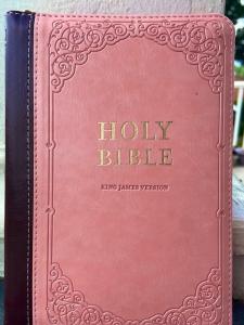 A pink and tan copy of the Holy Bible King James Version