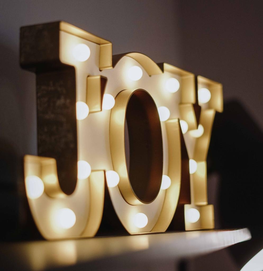 joy spelled in letters with lights inside