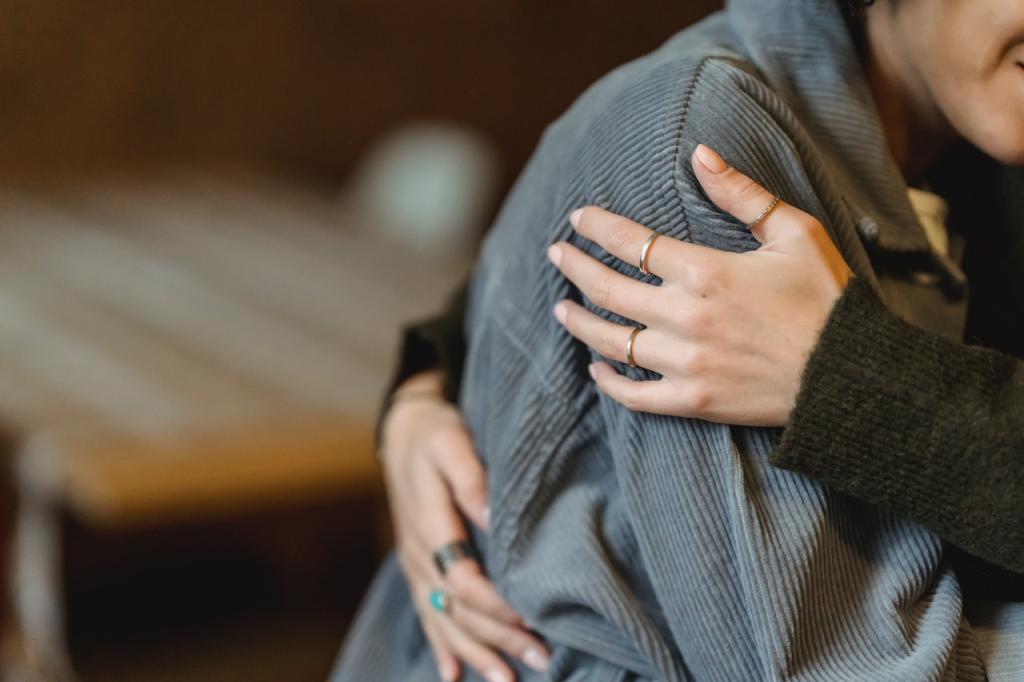 A person receives a hug from someone off camera.