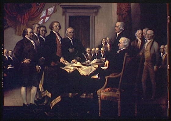 Men around table signing the Declaration of Independence