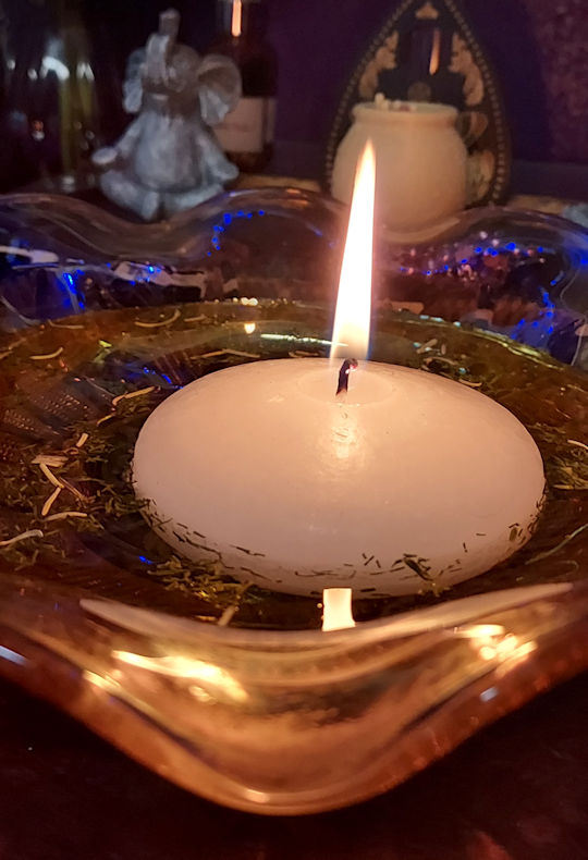 Candle floating on water