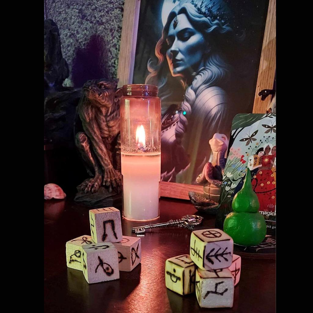 dice with rune on table with candle