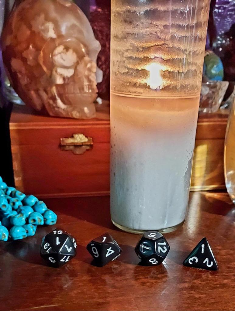 candle with dice in front