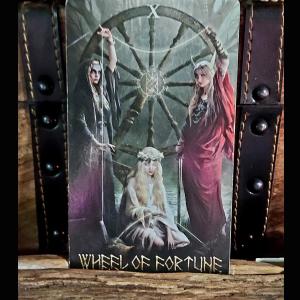 three women weave the threads of life