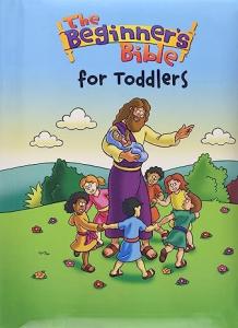 Front cover of the Beginners Bible for Toddlers book featuring a brightly colored cartoon drawing of Jesus surrounded by children forming a circle around him, holding hands.