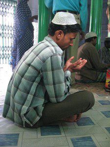 A praying Muslim man