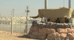 Soldiers, protect a Syrian refugee camp