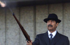 Saddam Hussein with a rifle