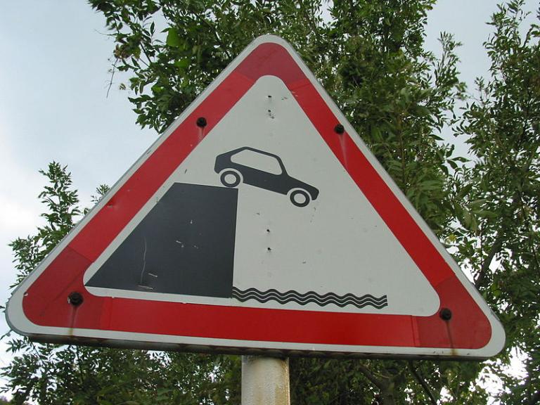 Car off the cliff signage