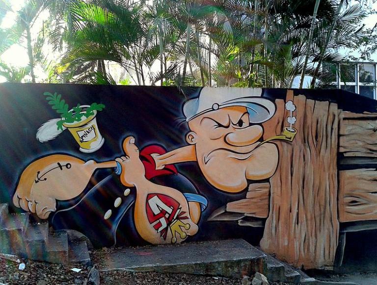 Popeye, with can of spinach