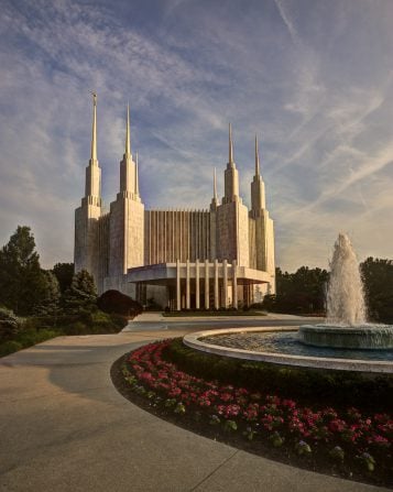 A daytime view of the DC Temple and a fountain