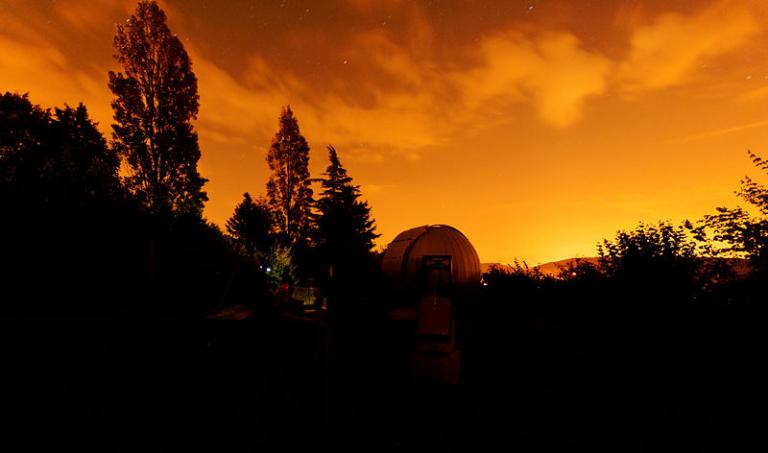 Sunset over an astronomical observatory
