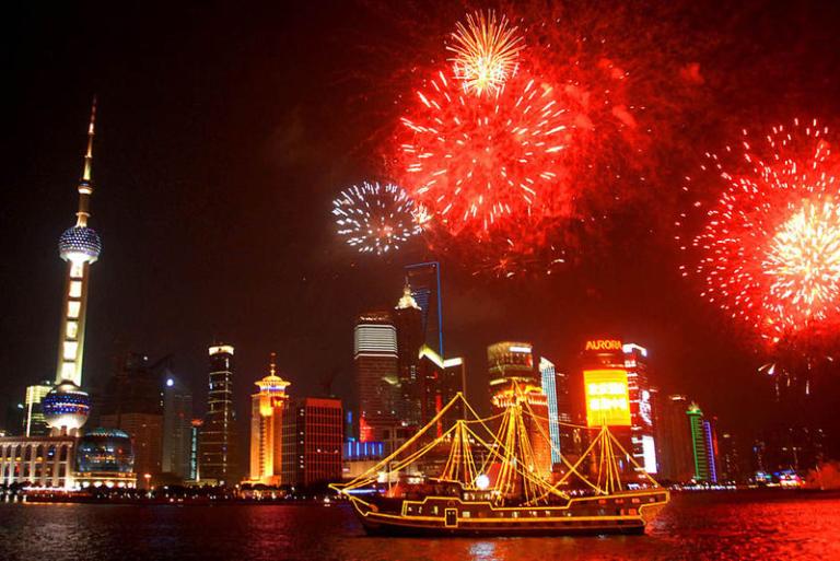 Shanghai at night, with fireworks.