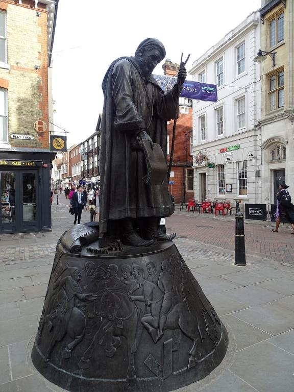 Canterbury statue near restaurant sldkflskjflks