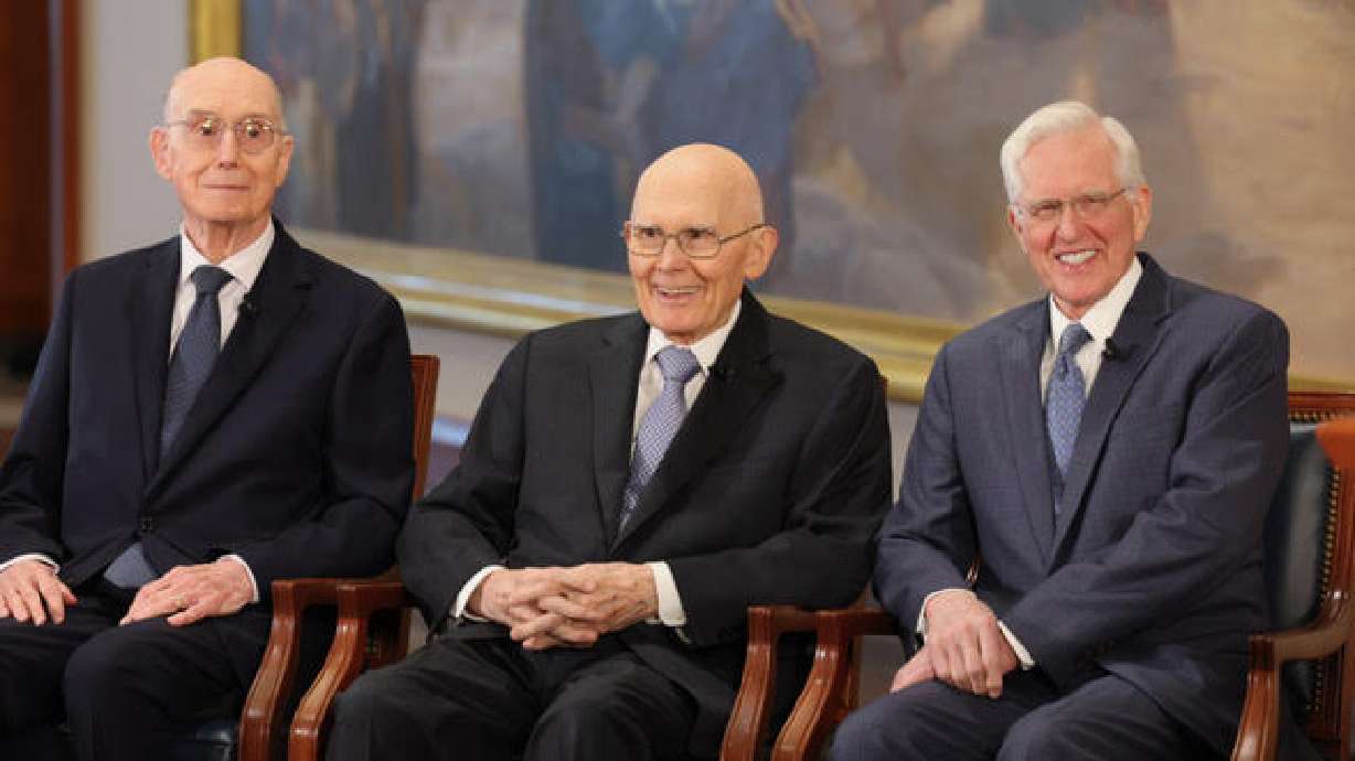 President Oaks, flanked by counselors