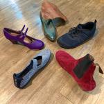 Purple flamenco shoe, green cowboy boot, black sneaker, red flamenco boot, silver Mary Jane shoe