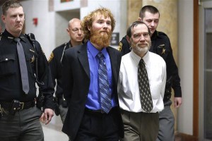 After hearing their guilty verdicts, handcuffed Old Testament prophets Esten and Timothy Ciboro smile for no reason whatsoever. Toledo Blade photo by Andy Morrison.