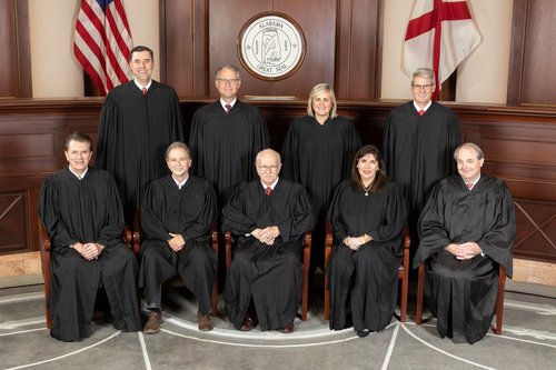 Makes vivid who constitutes the Alabama Supreme Court by showing justices with Chief Justice Tom Parker in center.