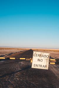 Road with a border on it and a sign in a foreign language