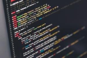 Dark screen with colored computer code