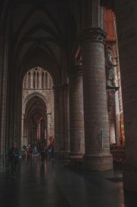 People standing and looking around in a church