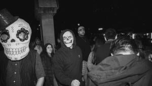 Group of people wearing scary masks