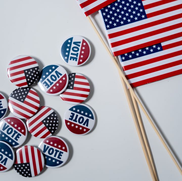 A few small American flags and buttons that remind Americans to vote.
