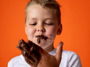 Kid eating chocolate