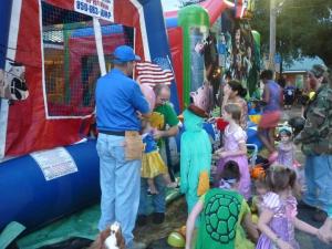 Children in bouncy house at fall festival
