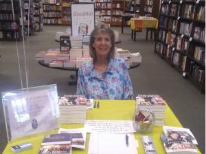 The author at a book signing table