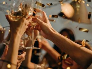 People toasting with champagne glasses