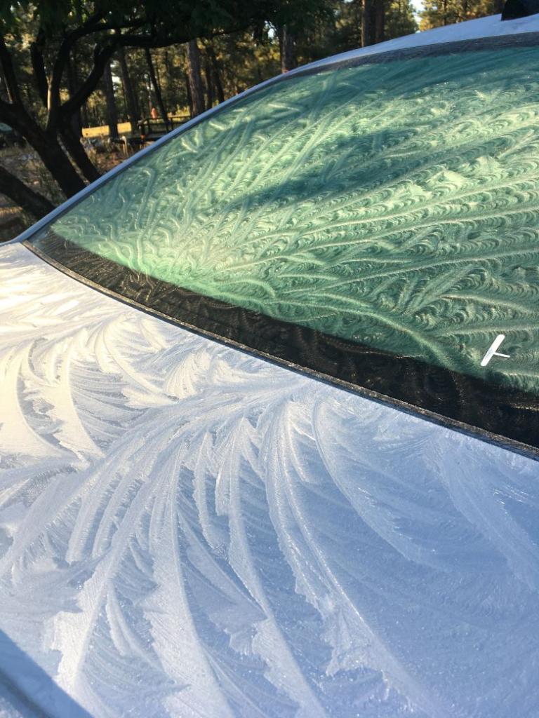 Ice artistry in a windshield of a Chevy Cruse