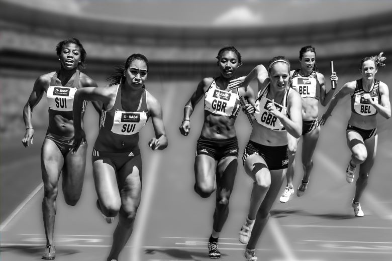 black and white photo Ladies running a race