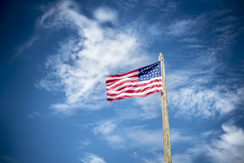 American Flag with blue sky backdrop