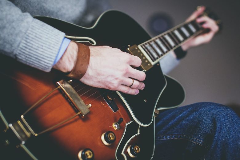 man playing guitar