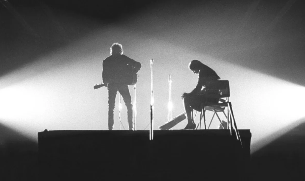 Bob Dylan with Joan Baez sharing an intimate moment, New Haven, Connecticut, 1965