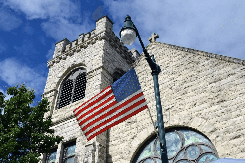 Church outside with a polling booth and an American flag -- "Republican Christianity"