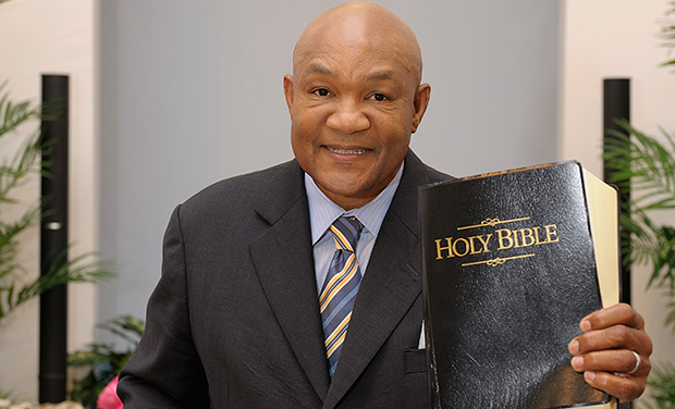 George Foreman holding his Bible in his church