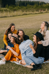 group of young women enjoying time outdoors together