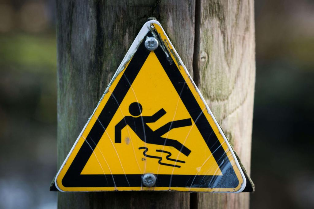 Slip on ice sign bolted to a telephone pole