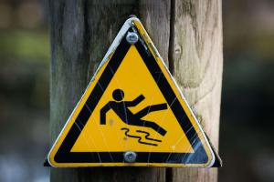 Slip on ice sign bolted to a telephone pole