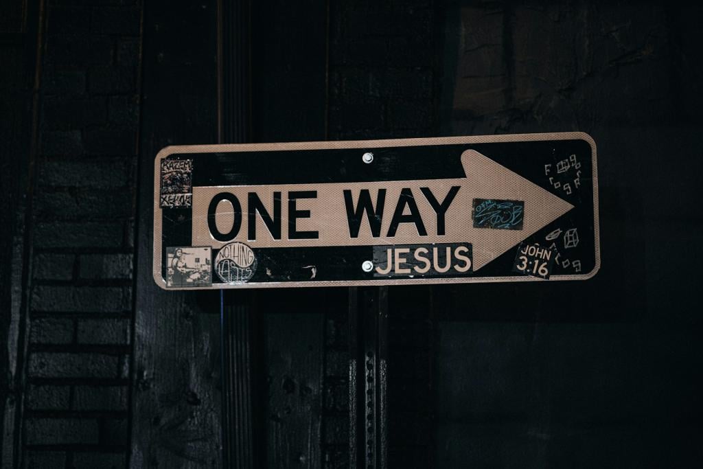 A "One Way" signed with many Christian stickers on it, showing Jesus is the only way to salvation.