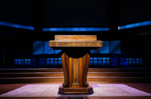 An empty lectern in a church's pulpit
