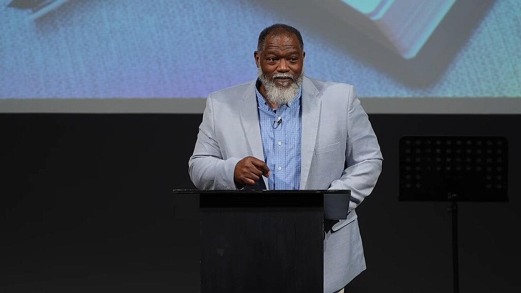 Dr. Voddie Baucham delivering an address about the Book of Revelation to the Hope Reformed Baptist Church in 2025