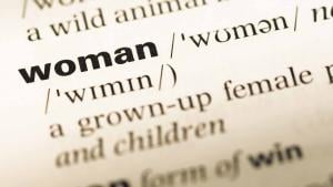A close-up of the word "Woman," as defined in the Oxford Dictionary