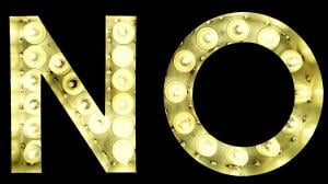 The word NO lit up by light bulbs