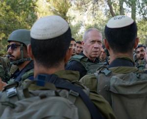 Israeli Defense Minister Yoav Gallant meets troops on the Gaza border, October 10, 2023.